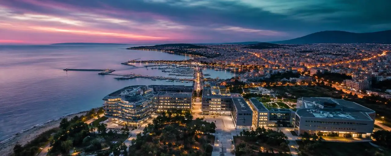 Coastal city at dusk with research buildings